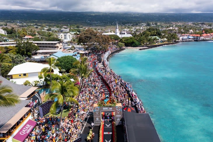 Crowds storm the finish like at the Hawaii Ironman World Championship