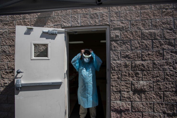 In July, Jose Macias, a licensed vocational nurse at Centro Medico Cathedral City prepares to begin his workday administering COVID-19 tests.