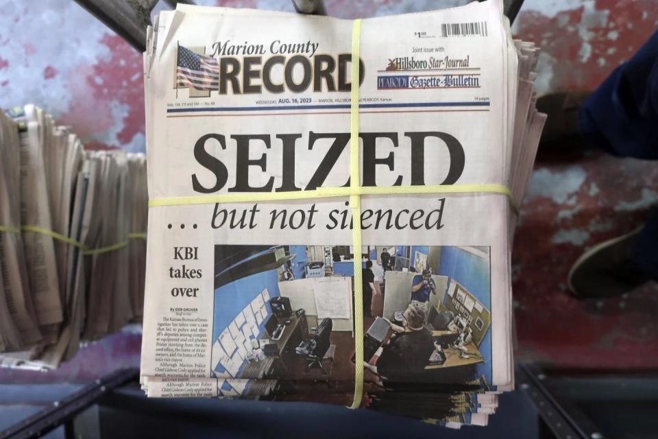 A stack of the latest weekly edition of the Marion County Record sits in the back of the newspaper's building, awaiting unbundling, sorting and distribution, on Aug. 16. The newspaper's front page was dedicated to two stories about a raid by local police on its offices.