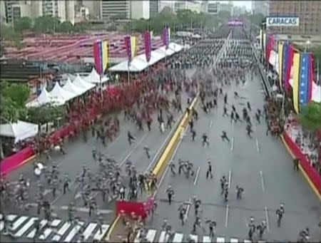 Venezuelan National Guard soldiers run during an event which was interrupted, in this still frame taken from video August 4, 2018, Caracas, Venezuela. VENEZUELAN GOVERNMENT TV/Handout via REUTERS TV