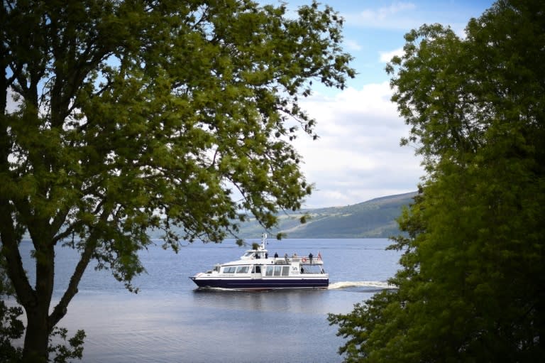 Tourists try to catch a glimpse of the famous monster on boat trips