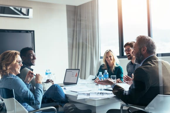 People in a conference room, collaborating at a business meeting