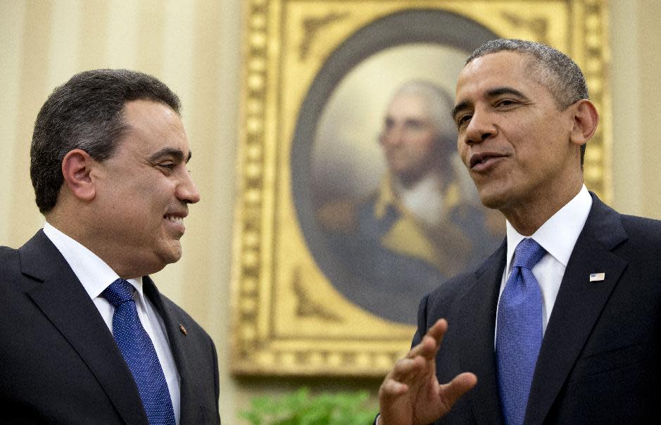 President Barack Obama talks with Tunisian Prime Minister Mehdi Jomaa, Friday, April 4,2014, in the Oval Office of the White House in Washington. (AP Photo/Carolyn Kaster)