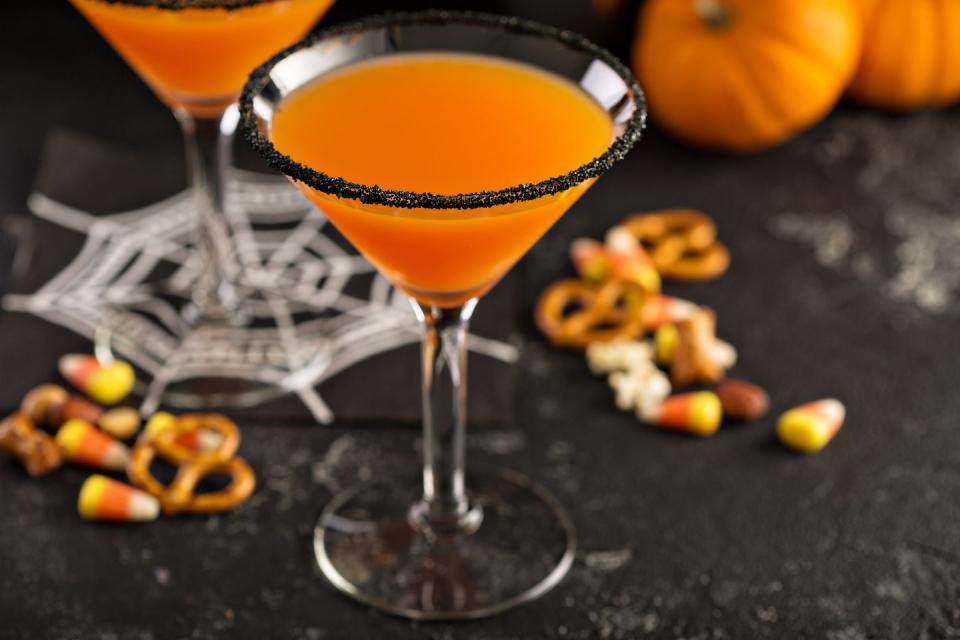 <p>With so many <a href="https://www.countryliving.com/food-drinks/g2640/halloween-cocktails/" rel="nofollow noopener" target="_blank" data-ylk="slk:festive Halloween cocktails;elm:context_link;itc:0;sec:content-canvas" class="link ">festive Halloween cocktails</a> that are equal parts terrifying and tasty, you can easily invite guests to bring their own concoctions to the party. Hold a competition to see whose cocktail comes out on top, and give the winner candy, bragging rights, or a brand new bottle of boo-ze.</p>