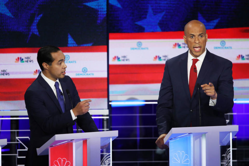 Former housing secretary Julian Castro and New Jersey Sen. Cory Booker during the first night of the Democratic presidential debate on June 26, 2019. | Joe Raedle—Getty Images