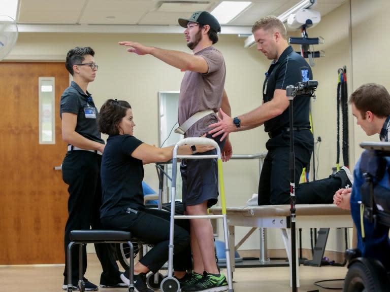 Man paralysed from waist down makes history by walking again using mind-controlled implant to power his legs