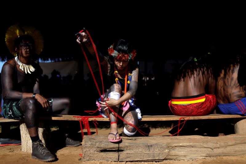 An Indigenous woman is pictured during a four-day pow wow in Piaracu village, in Xingu Indigenous Park, near Sao Jose do Xingu, Mato Grosso state