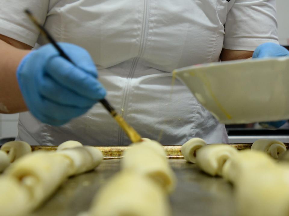 A prison cook prepares food.