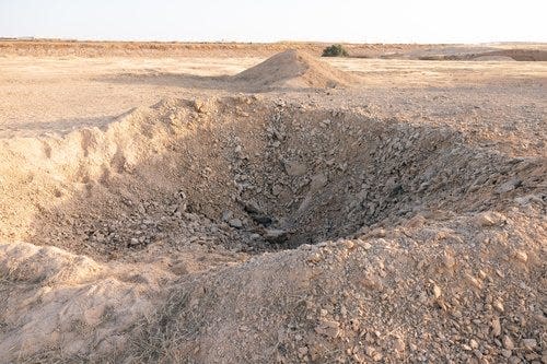 Damage from a missile impact at an Israeli airbase.