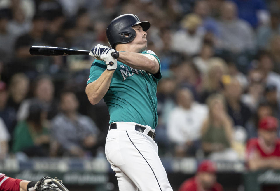 Seattle Mariners' Jay Bruce hits a solo home run off of Los Angeles Angels starting pitcher Tyler Skaggs during the seventh inning of a baseball game Friday, May 31, 2019, in Seattle. The home run was the 300th of Bruce'S career. (AP Photo/Stephen Brashear)