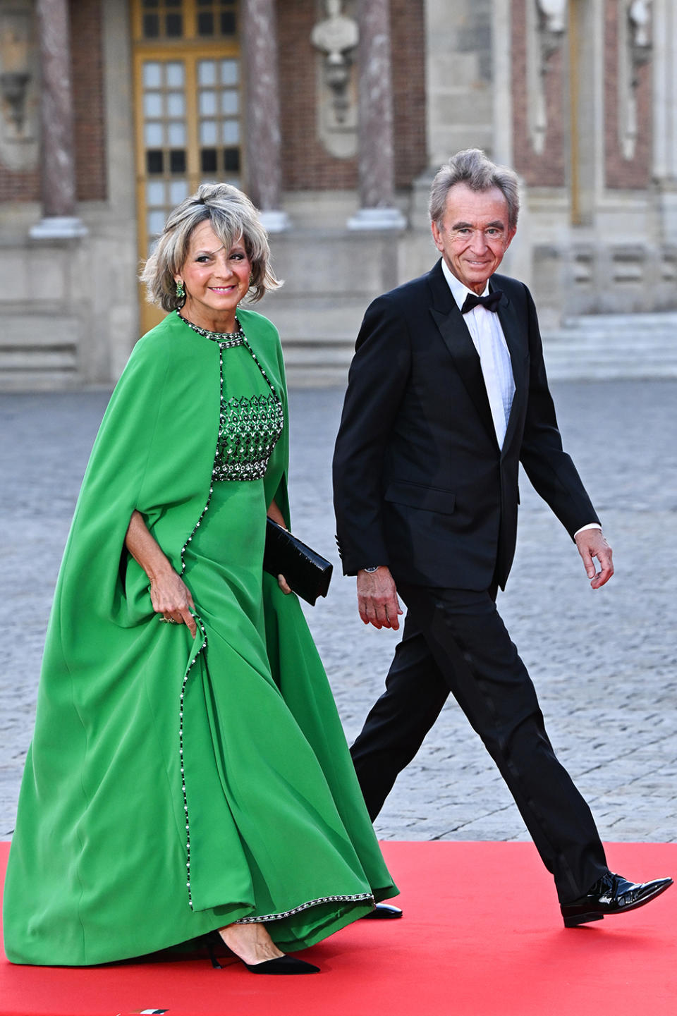 elene Mercier and Bernard Arnault arrive at the Palace of Versailles ahead of the State Dinner on September 20