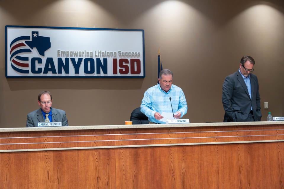 Bill Jenkins, president of Canyon Independent School District Board of Trustees, reads a resolution Monday night during a school board meeting in Canyon.