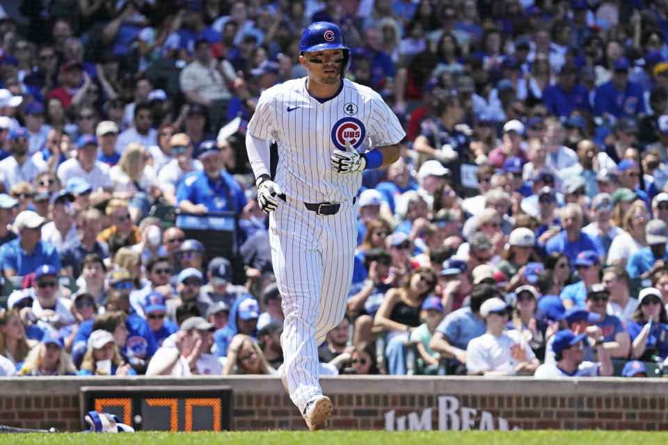 Chicago Cubs' Seiya Suzuki, of Japan, walks to first base during the third inning of a baseball game against the Cincinnati Reds in Chicago, Sunday, June 2, 2024. (AP Photo/Nam Y. Huh)