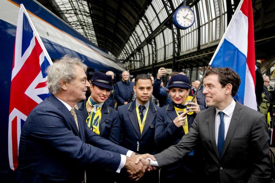 Eurostar CEO Nicolas Petrovic, right, and Roger van Boxtel, CEO of Dutch train company NS, shake hands (EPA)