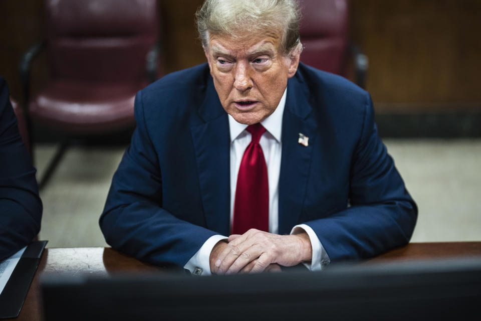 Former President Donald Trump arrives with his legal team at Manhattan Criminal Court ahead of the start of jury selection in New York on Monday, April 15, 2024. (Photo by Jabin Botsford/Washington Post via AP, Pool)