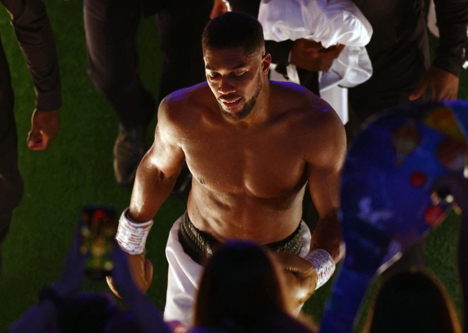 Anthony Joshua leaves the arena after losing to Oleksandr Usyk during their heavyweight boxing match at Tottenham Hotspur Stadium.