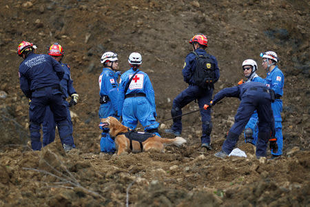 Rescuers search for survivors or victims of a landslide that affected the Medellin-Bogota highway in Colombia October 26, 2016. REUTERS/Fredy Builes