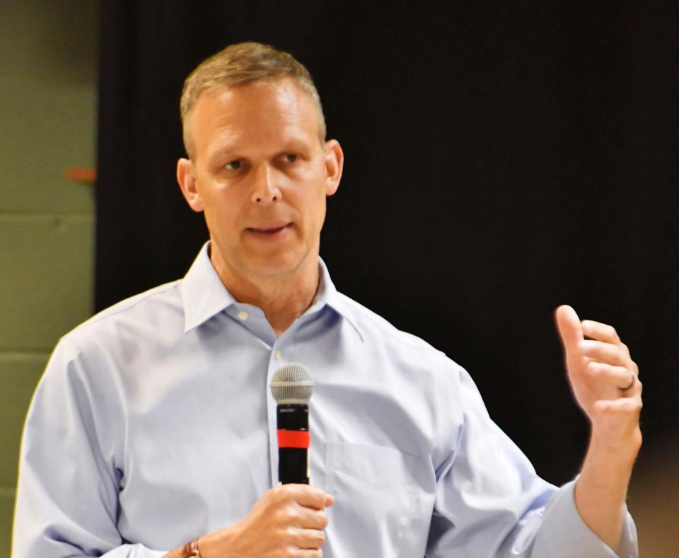 In this file photo, Republican U.S. Rep. Scott Perry of Pennsylvania speaks during a town hall meeting with a politically divided crowd at the Hummelstown Fire Department.