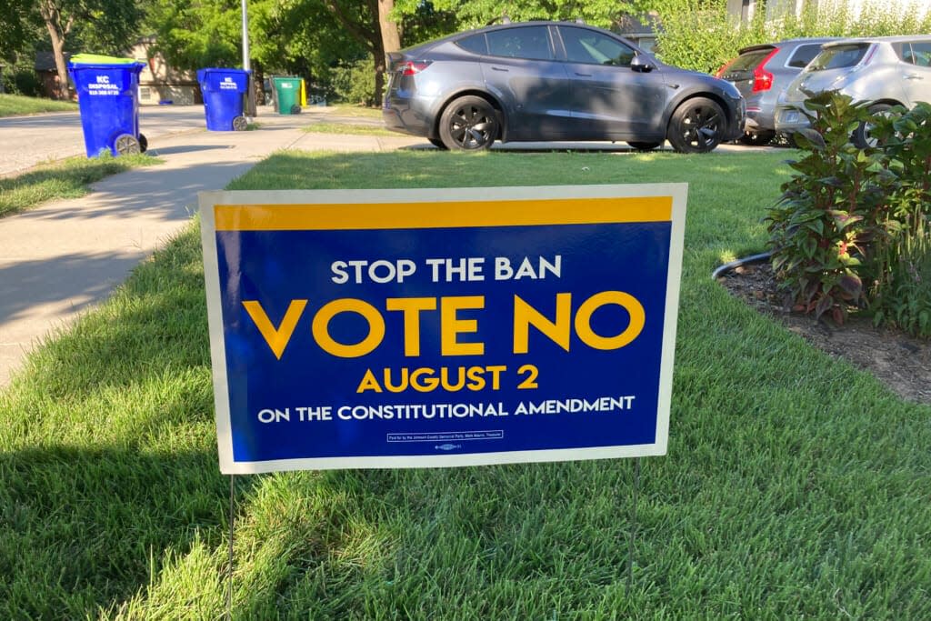 In this photo from Thursday, July 14, 2022, a sign in a yard in Merriam, Kansas, urges voters to oppose a proposed amendment to the Kansas Constitution to allow legislators to further restrict or ban abortion. Opponents of the measure believe it will lead to a ban on abortion in Kansas. (AP Photo/John Hanna)