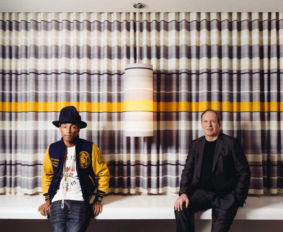 In this Tuesday, March 25, 2014 photo, Pharrell, left, and Hans Zimmer pose at The Standard Hotel during press day for their collaboration on the soundtrack for "The Amazing Spider-Man 2," in Los Angeles. The film releases May 2, 2014. (Photo by Casey Curry/Invision/AP)