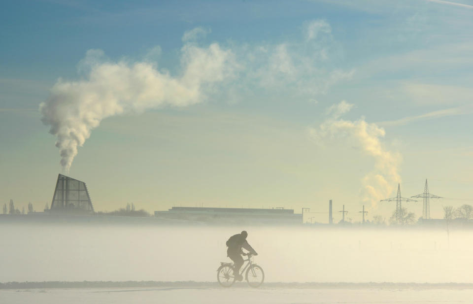 A man bikes along a snowy way near the village of Gemering, Germany, on Feb. 3.