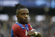 Crystal Palace's Wilfried Zaha reacts during the English Premier League soccer match between Manchester City and Crystal Palace at Etihad stadium in Manchester, England, Saturday, Jan. 18, 2020. (AP Photo/Rui Vieira)