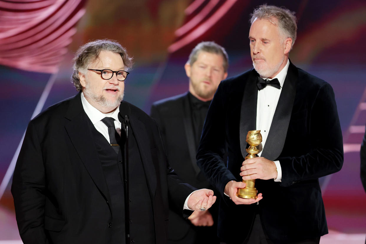 BEVERLY HILLS, CALIFORNIA - JANUARY 10: 80th Annual GOLDEN GLOBE AWARDS -- Pictured: (l-r) Guillermo del Toro and Mark Gustafson accept the Best Animated Feature award for 