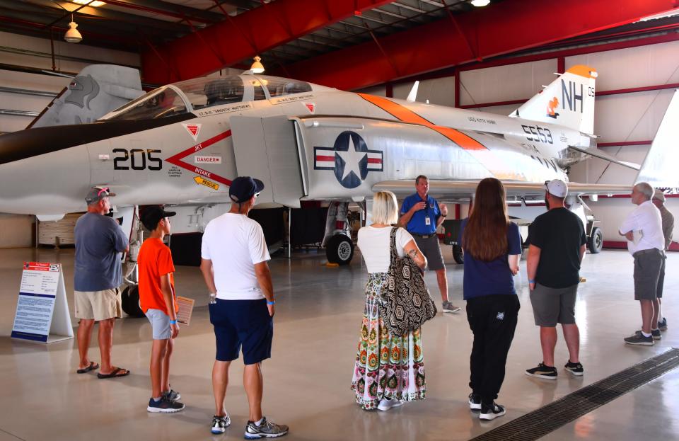 Volunteer docent Roger Hoos, talks about eh F4J Phantom II to a group touring the museum. Hoose flew F-4's in the service. The Valiant Air Command Warbird Museum in Titusville was one of the groups that lost their grant from the county. 