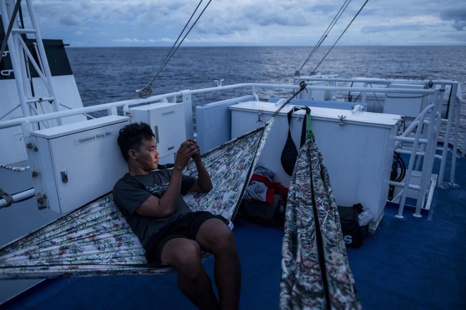 The crew on the BRP Sindangan pass the time enroute to resupply the BRP Sierra Madre on Nov. 9. (Photo: Lisa Marie David/Bloomberg)