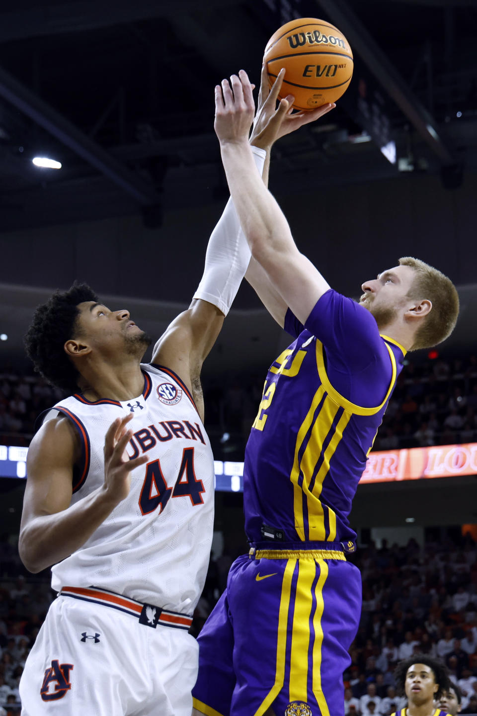 Auburn center Dylan Cardwell (44) blocks the shot of LSU forward Hunter Dean (12) during the first half of an NCAA college basketball game Saturday, Jan. 13, 2024, in Auburn, Ala. (AP Photo/Butch Dill)