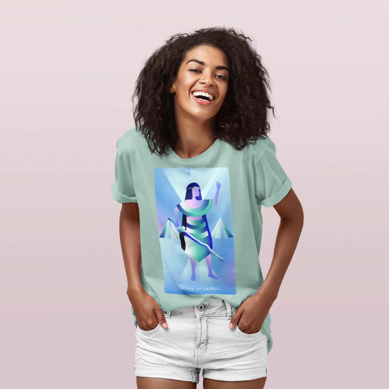 <p><a href="https://www.mysticmondays.com/products/queen-of-swords-t-shirt" rel="nofollow noopener" target="_blank" data-ylk="slk:Shop Now;elm:context_link;itc:0;sec:content-canvas" class="link rapid-noclick-resp">Shop Now</a></p><p>Queen of Swords T-Shirt</p><p>$38.00</p><p>mysticmondays.com</p>