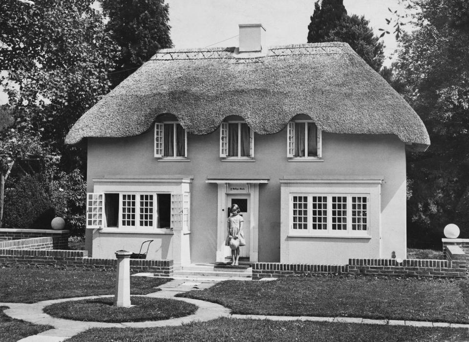 princess elizabeth stands in the doorway of y bwthyn bach &#39;the little cottage&#39; in welsh, situated in the grounds of the royal lodge, windsor, june 1933 the cottage was a gift to the princesses from the people of wales photo by central presshulton archivegetty images