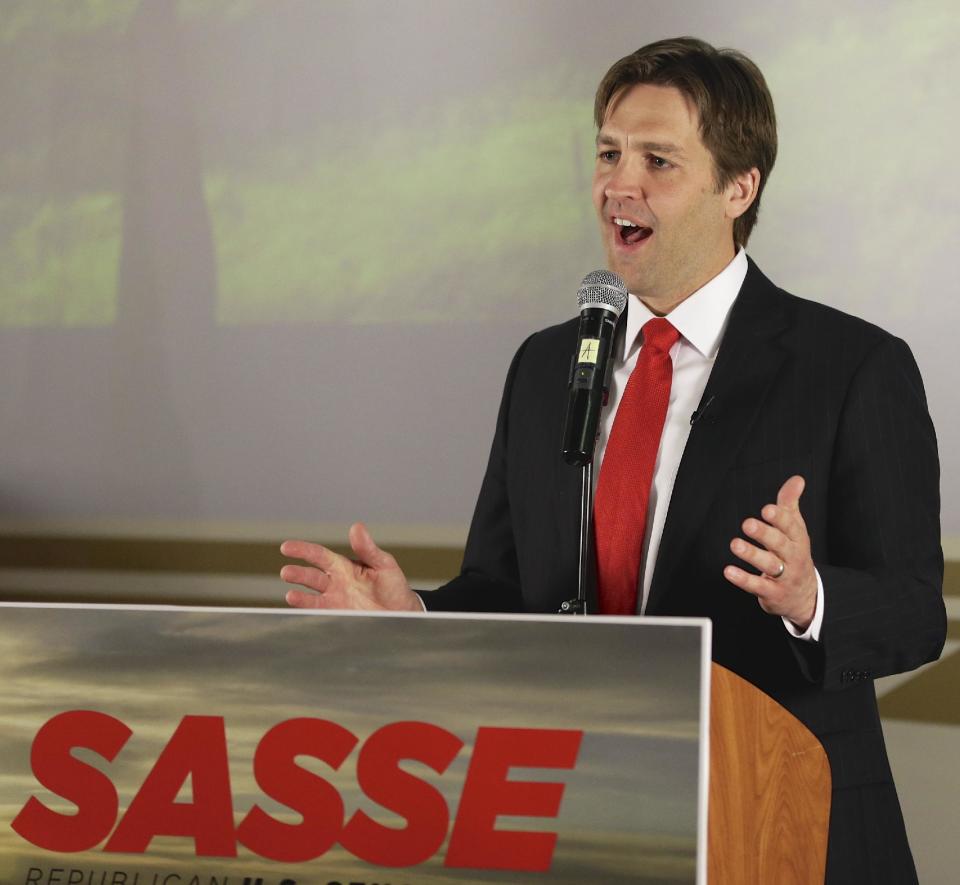 Republican Senate hopeful Ben Sasse speaks in Lincoln, Neb., Tuesday, May 13, 2014, after winning his party's primary election. A crowd of Republican candidates jockeyed to succeed Nebraska's outgoing governor and senior U.S. senator in a busy primary election where voters also were set to select nominees for three other vacant offices. (AP Photo)