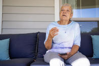 Sheri Wilkins talks about her experience using the DailyPay app outside of the clubhouse at her apartment complex in College Station, Texas on Tuesday, March 26, 2024. (AP Photo/Sam Craft)