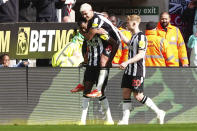 Newcastle United's Alexander Isak, left, celebrates with teammates scoring their side's third goal during the English Premier League soccer match between Newcastle United and Sheffield United at St. James' Park, Newcastle, England, Saturday, April 27, 2024. (Owen Humphreys/PA via AP)