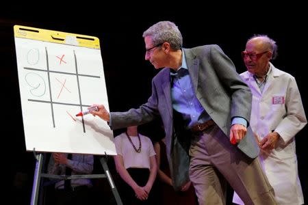 Nobel Laureates Eric Maskin and Dudley Herschbach play "Tick-Tock-Toe" during the 26th First Annual Ig Nobel Prize ceremony at Harvard University in Cambridge, Massachusetts, U.S. September 22, 2016. REUTERS/Brian Snyder