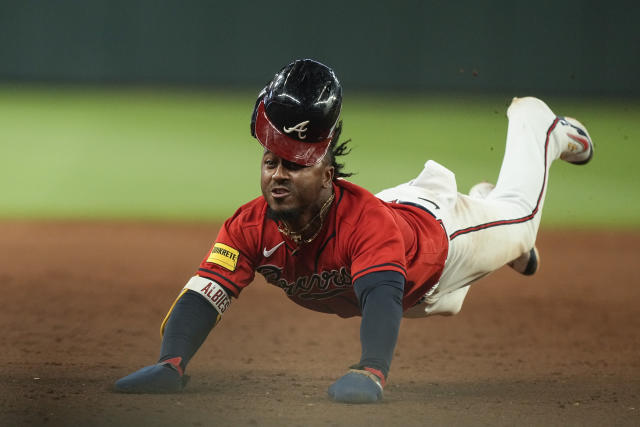 Orlando Arcia a hero again, Braves rally to edge Nationals