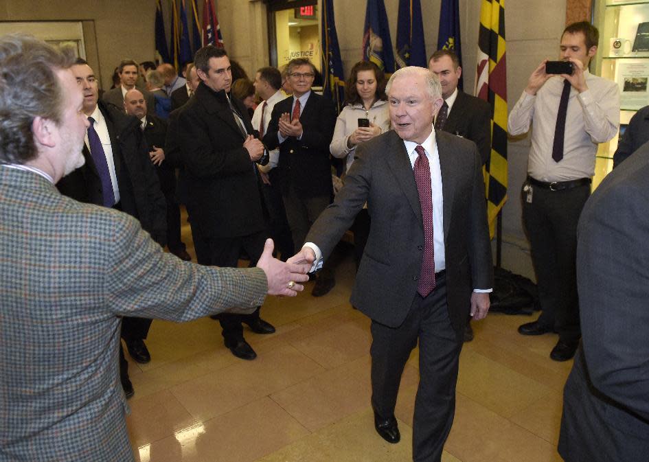 FILE - In this Feb. 9, 2017 file-pool photo, Attorney General Jeff Sessions is greeted by employees as he arrives at the Justice Department in Washington. The federal prison population is on the decline, but a new attorney general who talks tough on drugs and crime could usher in a reversal of that trend. The resources of a prison system that for years has grappled with overcrowding, but that experienced a population drop as Justice Department leaders pushed a different approach to drug prosecutions, could again be taxed. (AP Photo/Susan Walsh, File)
