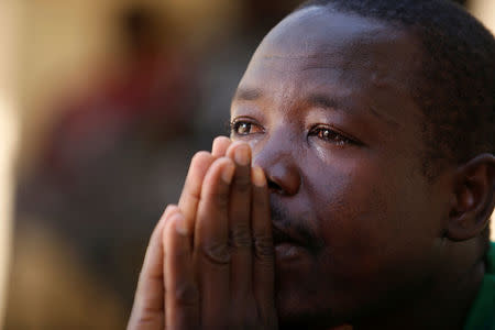 Bubacar Samba, a Gambian migrant who voluntarily returned from Libya, reacts during an interview at his home in Brikama, Gambia April 5, 2017. REUTERS/Luc Gnago