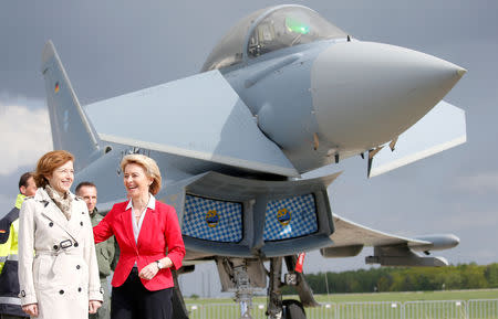 FILE PHOTO: German Defense Minister Ursula von der Leyen and French Minister of the Armed Forces Florence Parly stand next to Eurofighter as they visit the ILA Air Show in Berlin, Germany, April 26, 2018. REUTERS/Axel Schmidt/File Photo