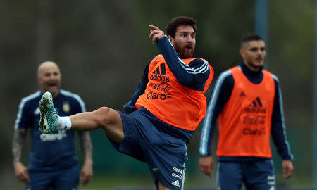 FILE PHOTO: Football Soccer - Argentina's national soccer team training - World Cup 2018 Qualifiers - Buenos Aires, Argentina - August 28, 2017 - Argentina's Lionel Messi takes part in a training session ahead of the match against Uruguay alongside team mate Mauro Icardi and head coach Jorge Sampaoli. REUTERS/Marcos Brindicci -/File Photo