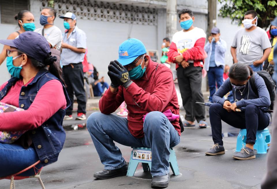 People queue outside a bank to collect government aid bonuses, in the Amazon city of Iquitos, in the Peruvian Loreto region, on June 15, 2020, amid the COVID-19 coronavirus pandemic. - Peru's GDP registered a historical fall of 40.49% year-on-year in April due to the semi-paralysis of its economy caused by the drastic confinement imposed by the coronavirus pandemic, the government reported on Monday. (Photo by Cesar Von BANCELS / AFP) (Photo by CESAR VON BANCELS/AFP via Getty Images)