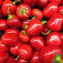 <p>These small, round, red peppers are almost too cute to eat. Also called pimiento or pimento, the cherry bell pepper is sweet in flavor. You'll find it stuffed in green olives or <a href="https://www.delish.com/cooking/recipe-ideas/recipes/a44541/baked-pimiento-cheese-dip-in-a-bread-bowl-recipe/" rel="nofollow noopener" target="_blank" data-ylk="slk:in pimento cheese;elm:context_link;itc:0;sec:content-canvas" class="link ">in pimento cheese</a>. </p><p> Scoville heat units: 500</p>