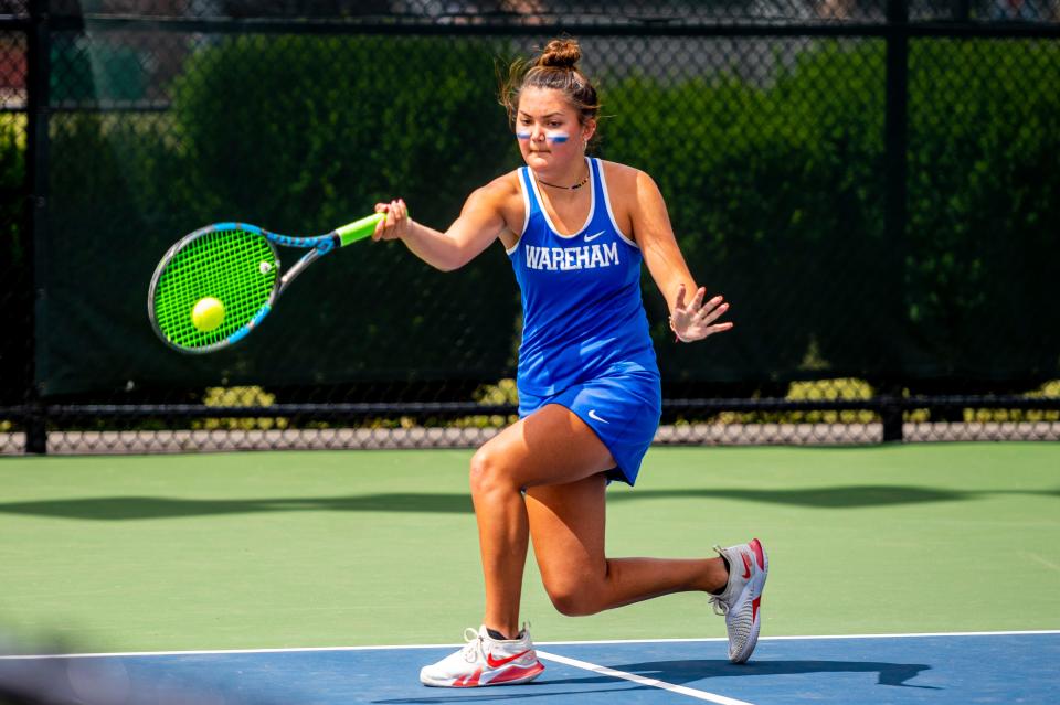 Wareham's Brooklyn Bindas moves along the baseline for the forehanded return against  Hamilton-Wenham's Sky Jara in the first singles matchup in the Division 4 State Finals.