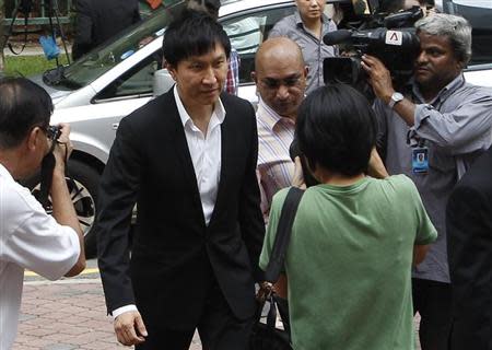 City Harvest Church founder Kong Hee arrives for his trial at the Subordinate Courts in Singapore May 15, 2013. REUTERS/Edgar Su/Files