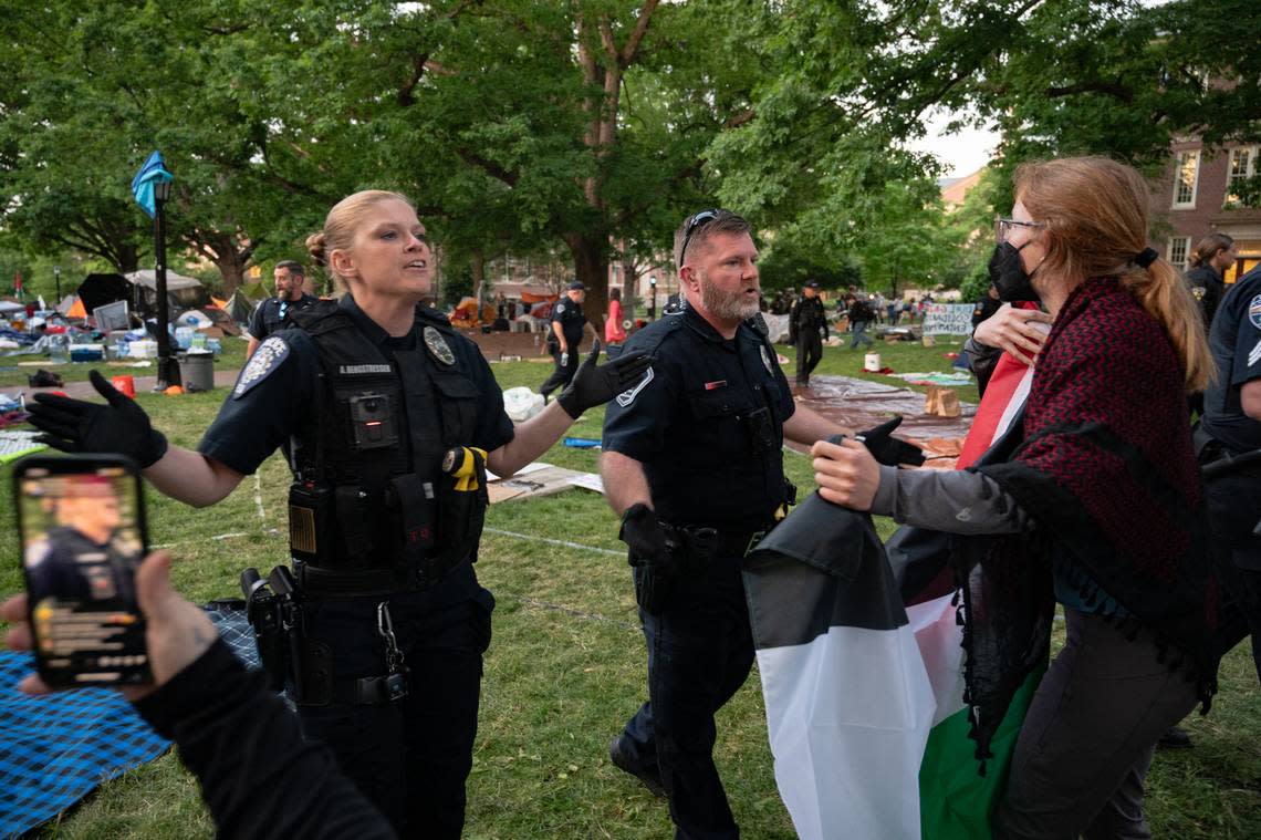Police officers move back a line of students who had been participating in a “pro-Palestine encampment” on Polk Place at UNC Chapel Hill on the morning of Tuesday, April 30, 2024. Heather Diehl