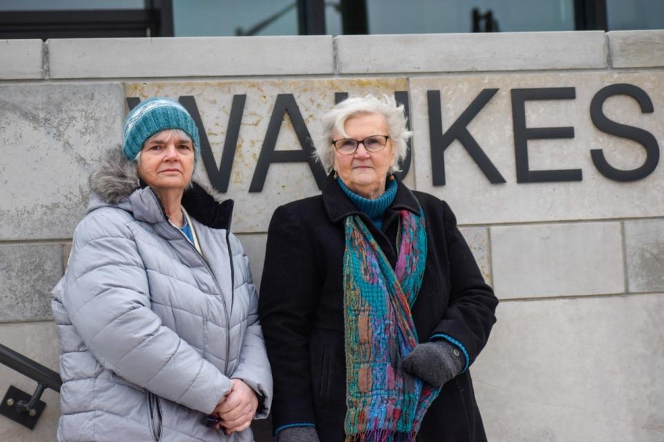 Sisters Mary and Fran O'Herron, both evacuated from their condos last year, joined the Horizon West Homeowners Association outside of Waukesha City Hall on Friday.