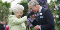 <p>Kissing his mother's hand after she presents him with the Royal Horticultural Society's Victoria Medal of Honour at the Chelsea Flower Show in London. </p>