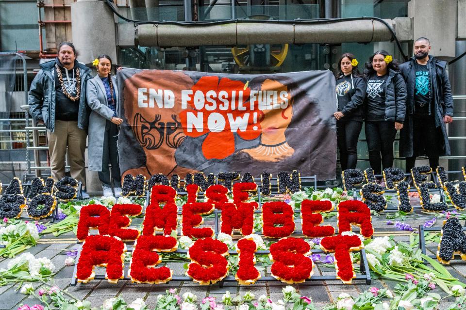 Demonstrators protest next to a climate justice memorial outside Lloyd’s of London on Friday (Guy Bell)