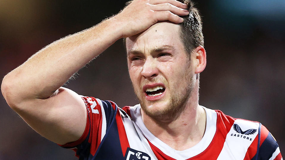 Pictured here, Luke Keary holds his forehead after the latest concussion scare to rock the Roosters star.